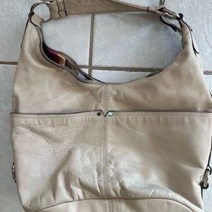 Tignanello beige purse.